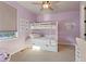 bedroom with bunkbeds, neutral carpet and ceiling fan at 507 Red Thistle Dr, Highlands Ranch, CO 80126
