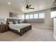 Spacious main bedroom with a ceiling fan, multiple windows, and neutral color scheme at 507 Red Thistle Dr, Highlands Ranch, CO 80126