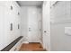 Functional mudroom with built-in storage cabinets, bench seating, and hardwood floors for easy organization at 507 Red Thistle Dr, Highlands Ranch, CO 80126