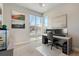 Bright home office with a modern desk, large windows, and stylish decor at 507 Red Thistle Dr, Highlands Ranch, CO 80126