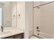 This bathroom features a tub with white tiled walls and a vanity with granite counters at 483 Agoseris Way, Castle Rock, CO 80104