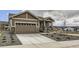 Charming single-Gathering home featuring a two-car garage and low maintenance xeriscape in front yard at 483 Agoseris Way, Castle Rock, CO 80104