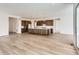 Spacious kitchen and living area, complete with a large island, modern appliances, and ample cabinet space at 483 Agoseris Way, Castle Rock, CO 80104