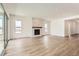 Bright, open living room featuring a modern fireplace and sliding glass doors to the backyard at 483 Agoseris Way, Castle Rock, CO 80104