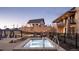 Community hot tub and pool area includes nearby lounging, manicured landscaping, and additional seating at 483 Agoseris Way, Castle Rock, CO 80104