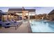 Community pool offers lounge chairs, cabanas and clear blue water for relaxing in the sun at 483 Agoseris Way, Castle Rock, CO 80104