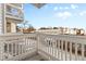 Balcony view with white railings, and a glimpse of the neighborhood at 14454 E Colorado Dr # 102, Aurora, CO 80012