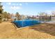 Community blue basketball court with playground and picnic tables, perfect for outdoor fun and neighborhood gatherings at 14454 E Colorado Dr # 102, Aurora, CO 80012