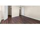 Room showcasing wood-look floors and a spacious layout at 14454 E Colorado Dr # 102, Aurora, CO 80012