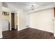 Bonus room or bedroom with wood floors, laundry hookups, and ample closet space at 14454 E Colorado Dr # 102, Aurora, CO 80012