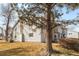 Two-story exterior home with a view of the chimney with a tall tree at 14454 E Colorado Dr # 102, Aurora, CO 80012