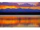 Beautiful community lake at sunset, perfect for relaxing and enjoying the natural surroundings at 14454 E Colorado Dr # 102, Aurora, CO 80012