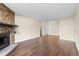Open living area showcasing the stone fireplace and modern flooring throughout at 14454 E Colorado Dr # 102, Aurora, CO 80012