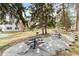 Outdoor picnic tables and grill in common area provides the perfect setting for community gatherings and dining at 14454 E Colorado Dr # 102, Aurora, CO 80012