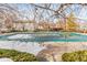View of community pool covered for the winter, promising summer relaxation and recreation at 14454 E Colorado Dr # 102, Aurora, CO 80012
