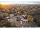 Beautiful aerial view of a residential neighborhood with lush greenery and city views at 6 Ivy Ln, Denver, CO 80220