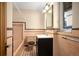 Cozy bathroom featuring colorful tiles and a modern vanity sink at 6 Ivy Ln, Denver, CO 80220