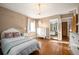 Charming bedroom with hardwood floors, natural light, and a white bedroom set at 6 Ivy Ln, Denver, CO 80220