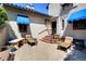 Inviting courtyard with patio furniture, blue awnings, and lush landscaping, perfect for outdoor relaxation at 6 Ivy Ln, Denver, CO 80220