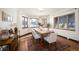 Formal dining room bathed in natural light, features a large table and seating for six at 6 Ivy Ln, Denver, CO 80220