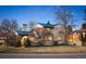 Charming two-story home with a blue tiled roof and manicured lawn at 6 Ivy Ln, Denver, CO 80220