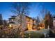 Rear exterior of home showing patio with lush vegetation at 6 Ivy Ln, Denver, CO 80220