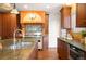 Gourmet kitchen boasts stone countertops, stainless steel appliances, and custom cabinetry for a luxurious cooking experience at 6 Ivy Ln, Denver, CO 80220