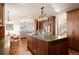Well-appointed kitchen with a large center island and wood cabinetry at 6 Ivy Ln, Denver, CO 80220