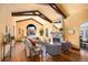Spacious living room with high ceilings, exposed beams, and fireplace at 6 Ivy Ln, Denver, CO 80220