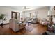Comfortable living room with ample seating, hardwood floors, and natural light at 6 Ivy Ln, Denver, CO 80220
