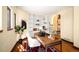 Charming home office with built-in shelving, hardwood floors, and an antique typewriter at 6 Ivy Ln, Denver, CO 80220