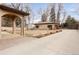 Backyard featuring a detached garage and covered patio at 6246 W 35Th Ave, Wheat Ridge, CO 80033