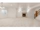 Spacious basement featuring carpet, recessed lighting, a fireplace, and a staircase at 6246 W 35Th Ave, Wheat Ridge, CO 80033