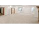 Spacious basement featuring carpet, recessed lighting, large windows, and an adjacent flex space at 6246 W 35Th Ave, Wheat Ridge, CO 80033