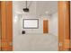 Media room with projector, screen, speakers, and wood-look door at 6246 W 35Th Ave, Wheat Ridge, CO 80033