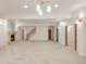 Spacious basement featuring carpet, recessed lighting, a fireplace, and staircase at 6246 W 35Th Ave, Wheat Ridge, CO 80033