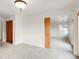 Neutral bedroom with wood doors and trim with an open doorway at 6246 W 35Th Ave, Wheat Ridge, CO 80033