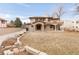 Exterior view of a two-story home, with an arched entry and second floor balcony at 6246 W 35Th Ave, Wheat Ridge, CO 80033