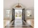 Inviting foyer with decorative tile flooring, a grand chandelier, and arched doorways leading to other rooms at 6246 W 35Th Ave, Wheat Ridge, CO 80033