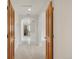 Hallway with two open wood doors, and hallway with view into bathroom at 6246 W 35Th Ave, Wheat Ridge, CO 80033