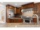 Gourmet kitchen featuring stainless steel appliances, granite countertops, and custom cabinetry at 6246 W 35Th Ave, Wheat Ridge, CO 80033