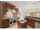 Gourmet kitchen features custom cabinets, stainless steel appliances, and granite countertops at 6246 W 35Th Ave, Wheat Ridge, CO 80033