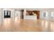 Open concept living space with kitchen and dining featuring hardwood flooring and archways at 6246 W 35Th Ave, Wheat Ridge, CO 80033