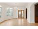 Bright living room with hardwood floors, a chandelier, large windows and archway to additional living spaces at 6246 W 35Th Ave, Wheat Ridge, CO 80033