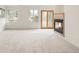 Cozy living room featuring plush carpeting, windows and modern fireplace at 6246 W 35Th Ave, Wheat Ridge, CO 80033