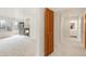 Spacious living room with walk-out access to balcony, fireplace and neutral colored carpet at 6246 W 35Th Ave, Wheat Ridge, CO 80033