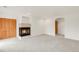 Spacious living room with neutral carpet and fireplace with decorative tile surround at 6246 W 35Th Ave, Wheat Ridge, CO 80033