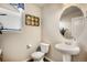 Clean bathroom with pedestal sink, toilet and shower/tub combo at 17395 Leisure Lake Dr, Monument, CO 80132