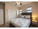 Cozy bedroom with double doors and ceiling fan at 17395 Leisure Lake Dr, Monument, CO 80132