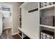 White built-in coat closet with shelving and bench at 17395 Leisure Lake Dr, Monument, CO 80132